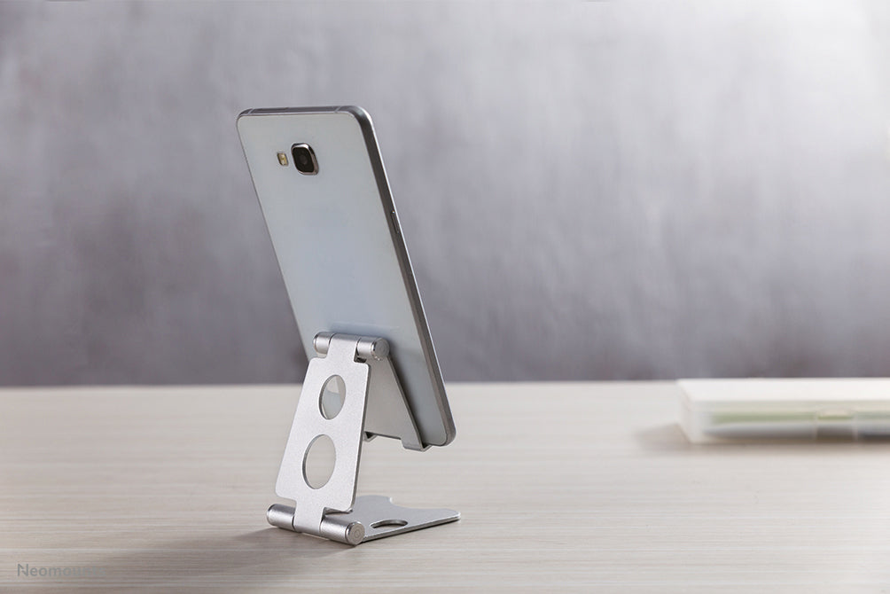 Neomounts universellt hopfällbart telefonstöd - Silver